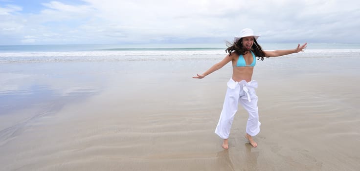 Woman enjoying her holiday in the beach in Brazil
