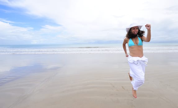 Woman enjoying her holiday in the beach in Brazil
