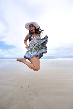 Woman enjoying her holiday in the beach in Brazil
