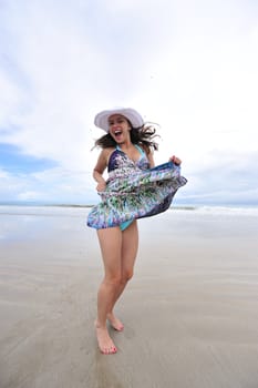 Woman enjoying her holiday in the beach in Brazil
