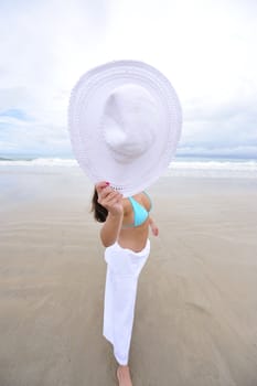 woman enjoying her holiday on a tropical beach in Brazil
