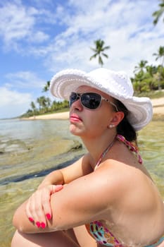 woman enjoying her holiday on a tropical beach in Brazil
