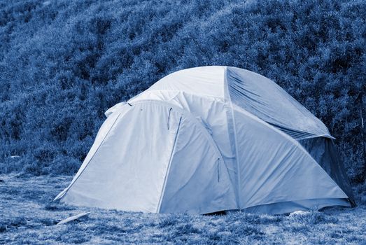 A forzen small tent in cold high moutain.