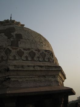 Evening light falling on the domed roof of an old Mughal Tomb