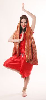 girl in red dancing in indian style
