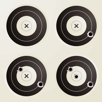 Collection of four targets with increasing amounts of bullet holes