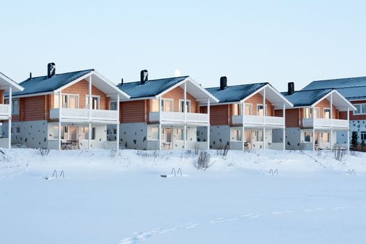 Lodges in snow, sundown, moon, winter, sky