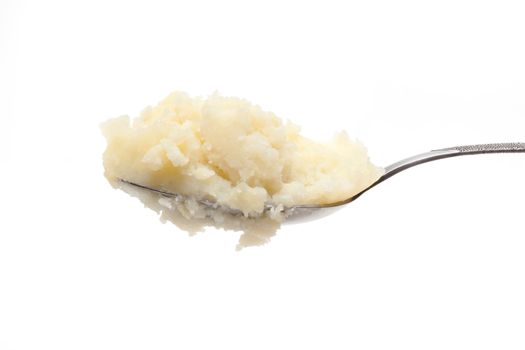 Spoon with mashed potatoes insulated on white background