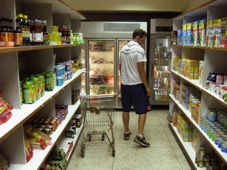 The interior view of a little grocery store