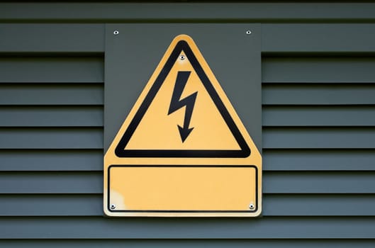 Sign on high electric voltage on a transformer box.