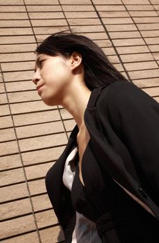 young asian business woman walking