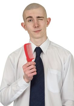 Absolutely bald guy with a hairbrush in a hand