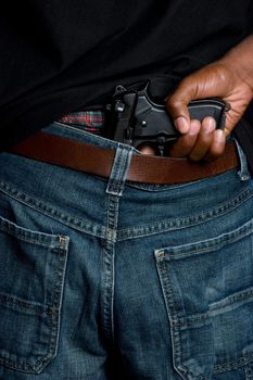 Man holding gun in pants