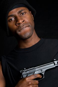 African american gangster holding gun