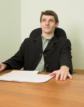 The clerk at office sits at a desktop