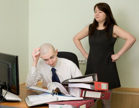 The bookkeeper and the secretary on a workplace at office