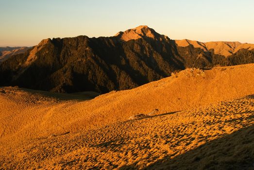 The sunrise golden beautiful high mountain landscape.