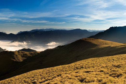 Clouds like sea and waterfall in high mountain.