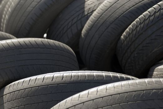 A pile used car tyres awaiting recycling

