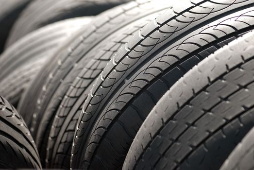 A pile used car tyres awaiting recycling

