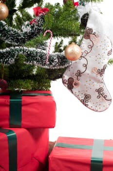 Christmas tree with toys and presents isolated on white