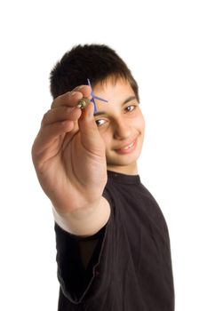 handsome teenage boy is playing darts isolated on white