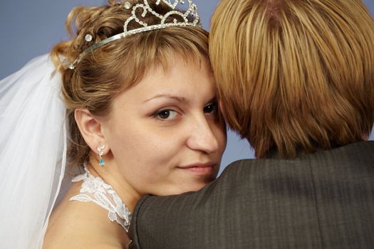 Happy bride put her head on his shoulder groom