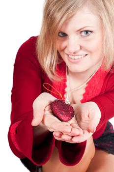 Beautiful woman hands with toy heart isolated on white