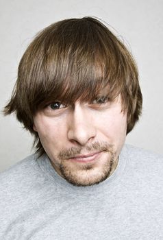 Closeup portrait of young man making grimace