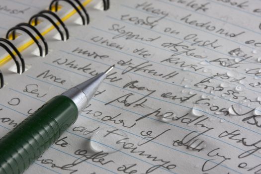 kayak expedition journal handritten with pencil on waterproof paper with water droplets - my actual writing during 2006 Watertribe Ultimate Florida Challenge, paddling across Everglades