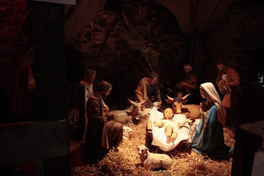 scene of the birth of christ in a stable