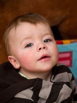 Cute little  baby boy looking  up 