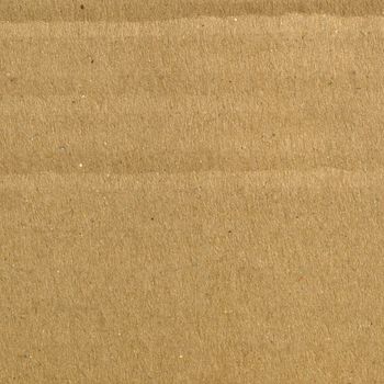 Brown corrugated cardboard sheet background material texture