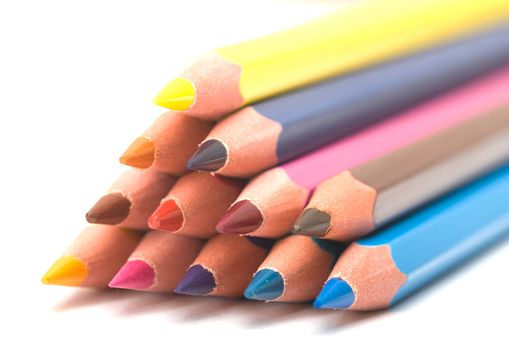 Set of colour pencils on a white background. Close up