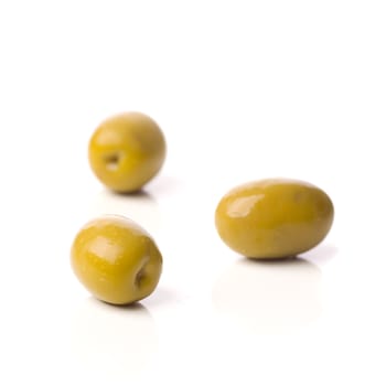 green greek olives on white background - healthy eating