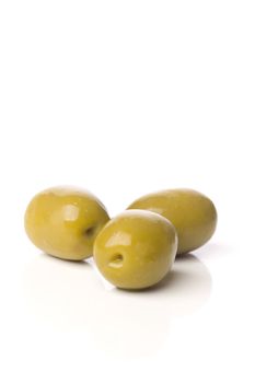 green greek olives on white background - healthy eating