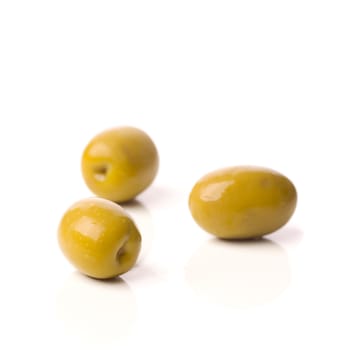 green greek olives on white background - healthy eating