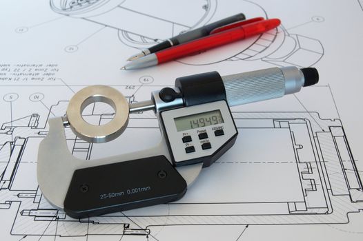 Micrometer and the workpiece on a technical drawing
