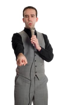 A young man wearing a grey suit is making a speech into the microphone, isolated against a white background