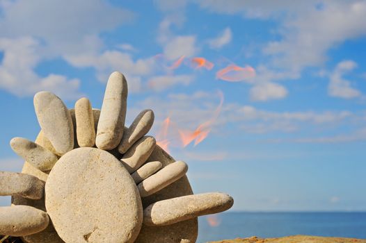 Symbol of the Sun from sea gravel