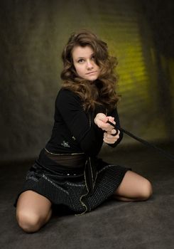 The beauty girl in black on dark background