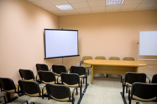 Interior of a small conference hall in pink tones