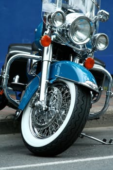 A blue motorcycle parked in the street