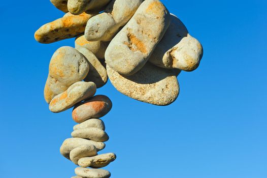Sea stones hanging in the blue sky
