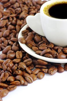 Coffee cup and grain on white