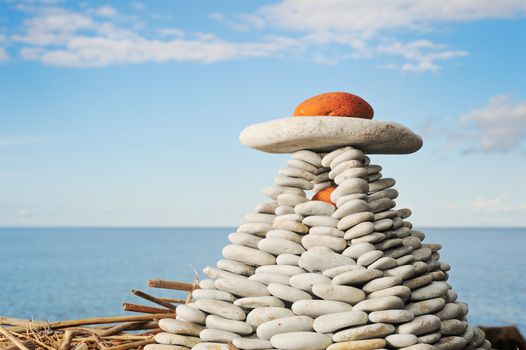 Pyramid from a pebble on sea coast