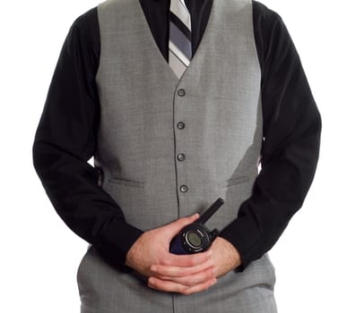 A security guard wearing a suit is holding a walkie-talkie, isolated against a white background