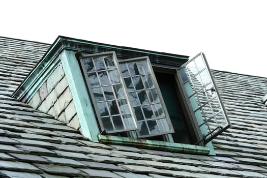 a old window on a slate roof