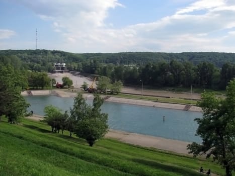 Park, pool, river, verdure, tree, blue sky, cloud, television antenna, dam, place for walks and rest, declivity, mountain, water, summer, day, city