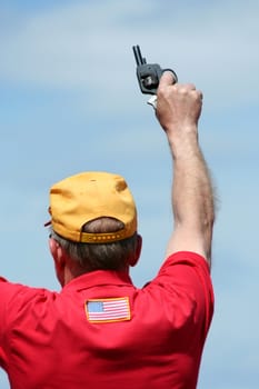 Man firing the starting gun for a race